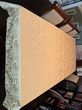 Gold damask tablecloth.
